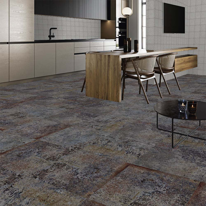 Kitchen diner featuring Boheme Sinora 60 × 60cm patterned porcelain floor tiles, combining deep blue, grey and rust tones with a layered, aged-effect finish. Brings warmth and an industrial edge to contemporary interiors.