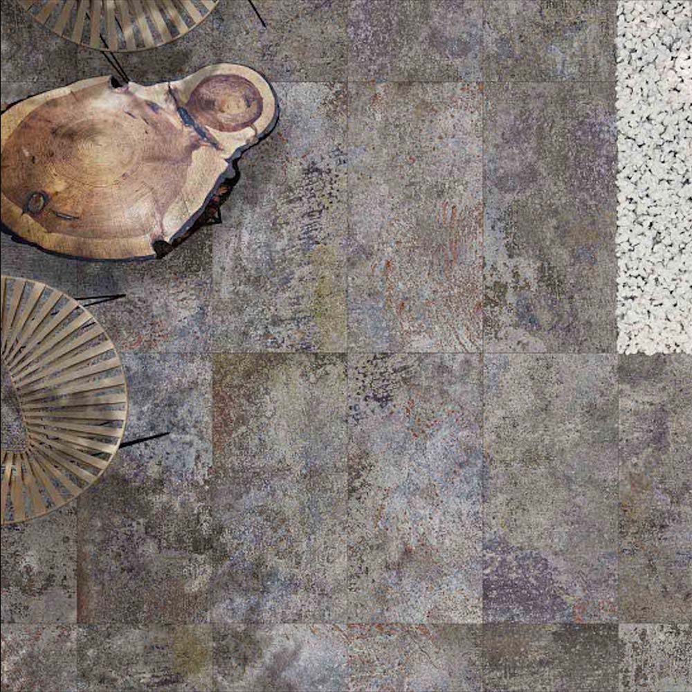 Outdoor setting featuring Boheme Sinora 2cm 50 × 100cm porcelain slabs, combining deep blue, grey and rust tones with a layered, aged-effect finish. Designed for outdoor use, bringing a bold, industrial-inspired look to exterior spaces.