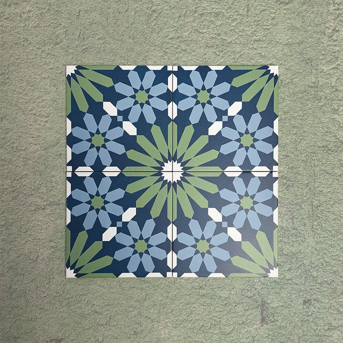 Four Fizaan Springs Moroccan-style 20×20cm porcelain tiles arranged to form a blue and green geometric star pattern.
