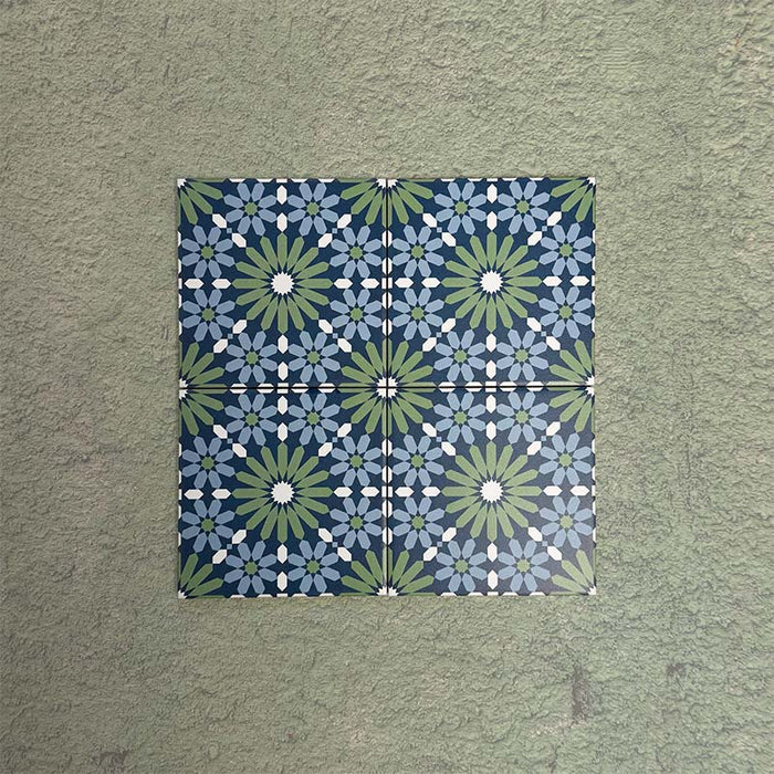 Fizaan Springs Mini Moroccan-style 15×15cm porcelain tiles laid in a repeating geometric pattern, featuring blue and green star motifs.