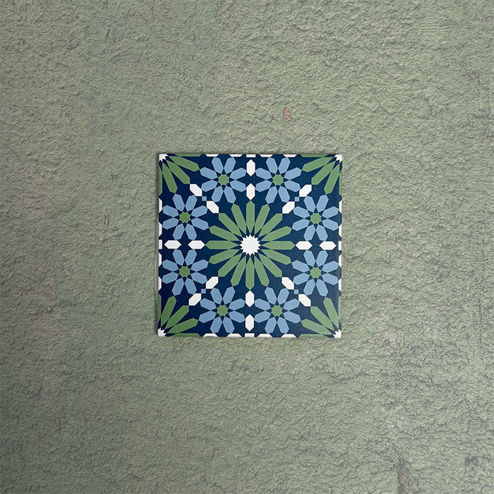 Fizaan Springs Mini Moroccan-style 15×15cm porcelain tile featuring a blue and green geometric star pattern.
