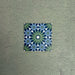 Fizaan Springs Mini Moroccan-style 15×15cm porcelain tile featuring a blue and green geometric star pattern.