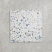 Single Confetti Tutti Frutti 25×25cm terrazzo-style porcelain tile featuring colourful multitone chips on a white base, displayed against a light textured background.