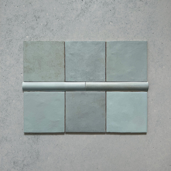 Zellij Aqua Blue Bullnose Moroccan Style 3cm x 20cm glazed ceramic trim tile in soft aqua blue tones, smooth rounded bullnose edge, glossy finish, handcrafted zellige look with subtle tonal variation, ideal for edging walls, niches, and decorative tile layouts.