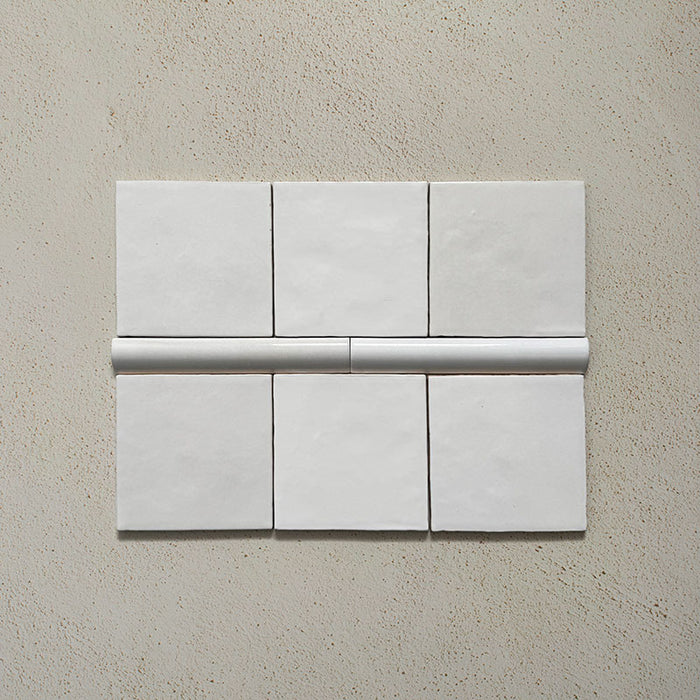Zellij White Gloss Bullnose Moroccan-style trims in a 3cm x 20cm format, featuring a glossy white glaze and smooth rounded profile, displayed as a flat lay on a neutral background.