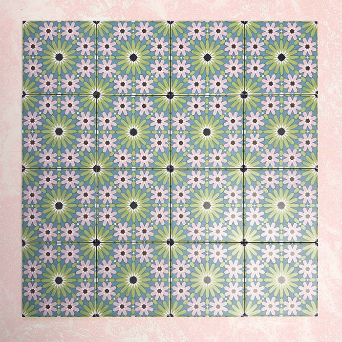 Fizaan Summer Mini Moroccan-style 15×15cm tiles laid in a repeating geometric pattern, featuring blue, green and pink floral star motifs.