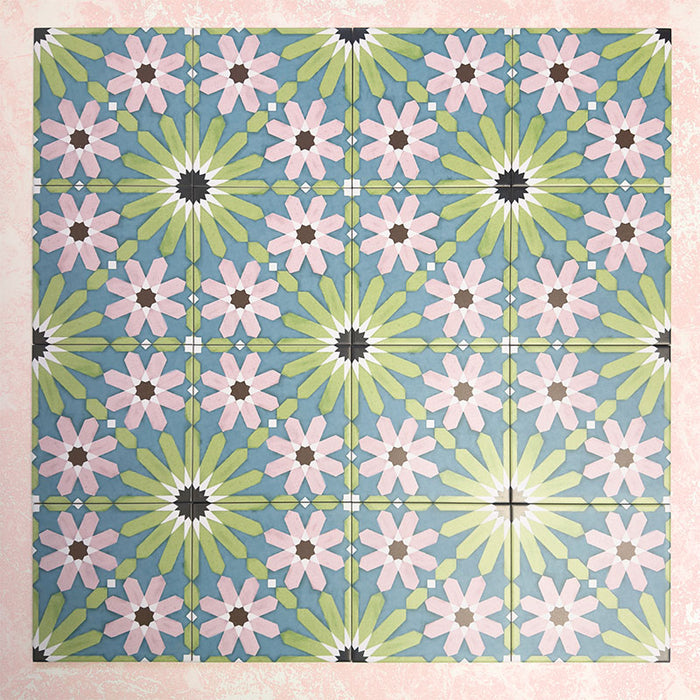 Fizaan Summer Moroccan-style 20×20cm porcelain tiles laid in a repeating geometric pattern, featuring blue, green and pink star motifs.