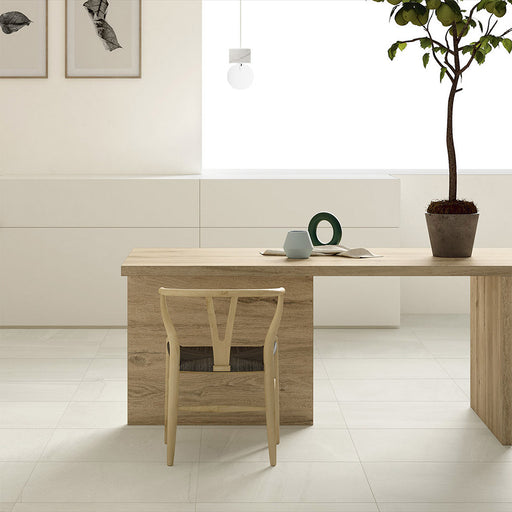 Dining area featuring Tane Stone Marfil Matt 30 × 60cm porcelain floor tiles, styled with light wood furniture, soft neutral tones, and minimalist décor for a calm, contemporary, Scandinavian-inspired space.