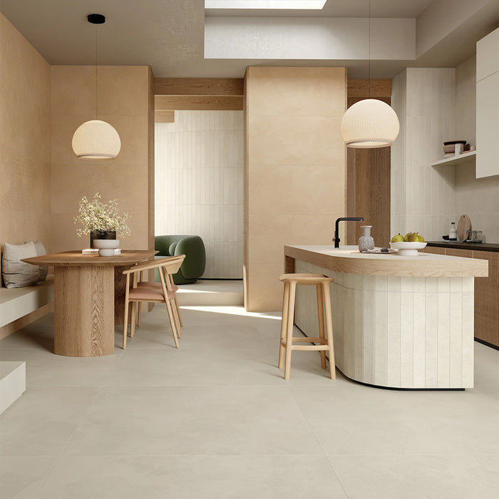 Kitchen interior featuring Tane Stone Marfil Matt 60 × 120cm porcelain floor tiles, styled with warm wood cabinetry, a central island, soft neutral tones, and natural light for a calm, contemporary finish.