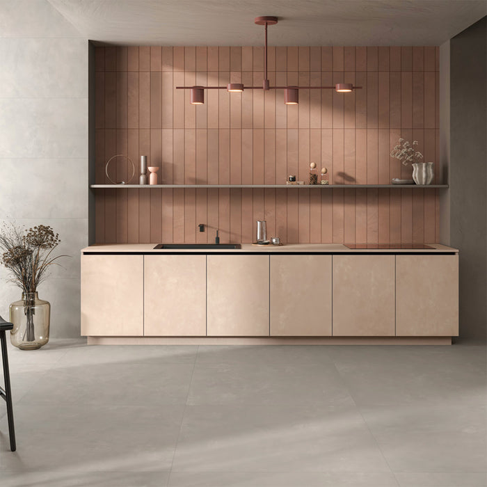 Kitchen interior featuring Tane Stone Pearl Matt 30 × 60cm porcelain floor tiles, styled with warm-toned cabinetry, a tiled feature wall, soft lighting, and neutral tones for a contemporary, design-led finish.