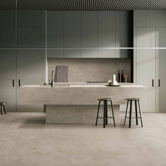 Kitchen interior featuring Tane Stone Pearl Matt 60 × 60cm porcelain floor tiles, styled with a minimalist island, sleek cabinetry, and soft neutral tones for a clean, contemporary, design-led space.