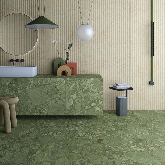 Contemporary bathroom featuring Terrace Terrazzo Green 60x60cm porcelain tiles across the floor and vanity. The soft green terrazzo effect is paired with textured cream fluted walls, a floating terrazzo vanity, minimalist black fittings and modern lighting, creating a fresh, nature-inspired bathroom design.