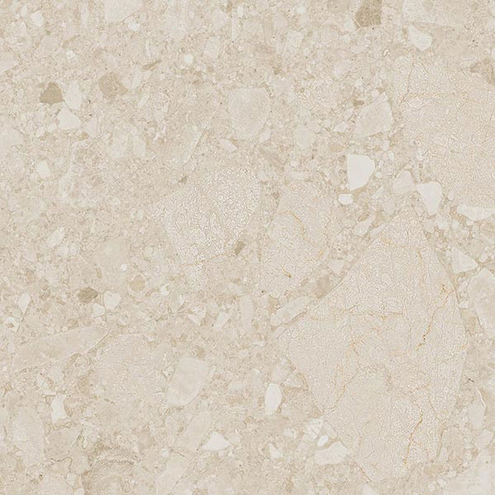 Close-up of Terrace Terrazzo Ivory 60x60cm porcelain tile featuring a soft ivory terrazzo effect. The design blends cream and beige stone fragments with delicate tonal variation, creating a warm, understated surface ideal for modern walls and floors.