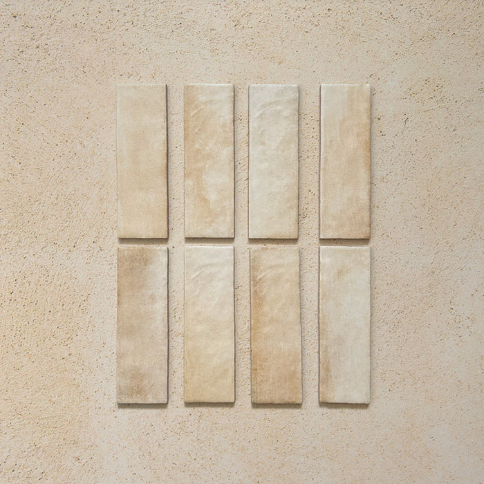 Zellij Arena Brick Moroccan Style 6.5cm x 20cm tiles, slim brick-format tiles in warm sandy beige with soft cream and honey undertones, natural tonal variation, lightly textured glazed finish, Moroccan-inspired handcrafted look.