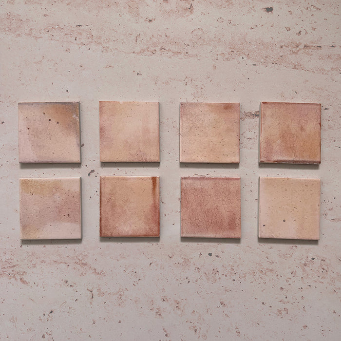 Beijing Rose Pink Square 10x10cm Moroccan-style ceramic wall tiles, styled on a soft pink textured background to highlight their natural glaze variation and handcrafted finish.