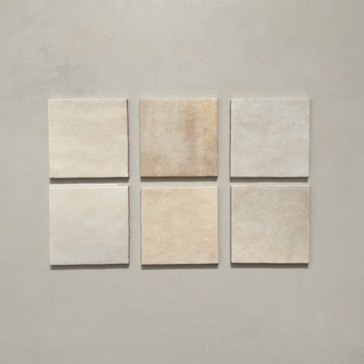 Zellij Bone Square Moroccan-style tiles in a 13.2cm x 13.2cm format, featuring warm beige tones with subtle tonal and handmade surface variation, displayed as a flat lay on a neutral background.