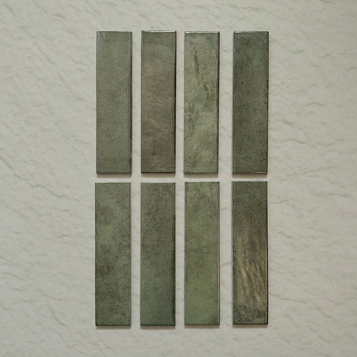Madison Sage Green Brick Wall Tiles 6x24.6cm — individual tile layout showing the deep, natural variation of sage tones. Each piece features subtle shading and a handcrafted glossy finish, perfect for adding warmth and character to kitchens, bathrooms, or statement walls.