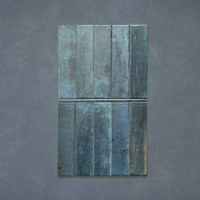 Izmir Blue Gloss Pencil Bullnose Border Tile 1.2x30cm — tiles and border.
Combining the Izmir Blue brick tiles with their matching pencil bullnose border, this layout highlights how the rounded trim creates a seamless, polished edge. The deep blue glaze and handcrafted texture add depth and sophistication — perfect for elevating kitchen splashbacks, bathrooms, or statement walls.