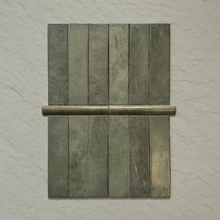 Madison Sage Green Brick Wall Tiles 6x24.6cm with Bullnose — showcasing the beautifully coordinated pairing of field tiles and matching bullnose trim. The glossy sage finish and handcrafted variation create a seamless, elegant edge detail perfect for polished bathroom or kitchen designs.