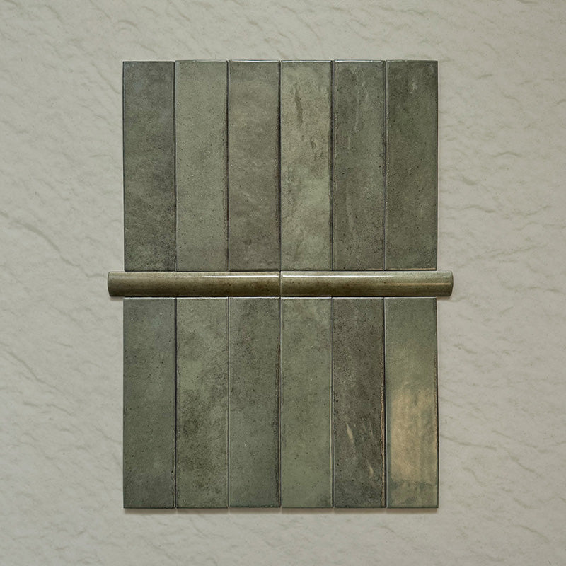 Madison Sage Green Brick Wall Tiles 6x24.6cm with Bullnose — showcasing the beautifully coordinated pairing of field tiles and matching bullnose trim. The glossy sage finish and handcrafted variation create a seamless, elegant edge detail perfect for polished bathroom or kitchen designs.