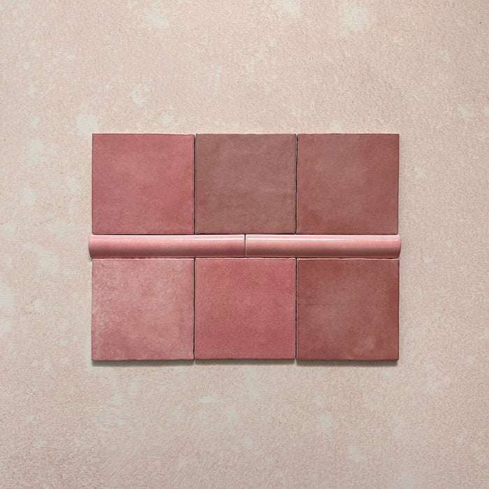 Zellij Rose Pink Square tiles with matching bullnose, 13.2cm x 13.2cm, Moroccan style square tiles shown with coordinating 3cm x 20cm bullnose trim, featuring warm rose pink tones, natural colour variation, softly uneven edges, and a glossy glazed finish for a handcrafted look.