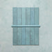 Madison Aquamarine Bullnose Pencil Border Tiles 3x20cm — shown with matching brick tiles, this elegant border piece completes the look with a soft, curved edge. The glossy teal glaze adds a polished finish, ideal for framing tiled walls or creating refined transitions in kitchens and bathrooms.