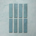 Madison Aquamarine Brick Wall Tiles 6x24.6cm — individual tile layout showcasing the rich teal tones and subtle surface variations. Each glossy brick-style tile reflects light beautifully, adding depth and a handcrafted charm perfect for modern kitchens, bathrooms, or feature walls.