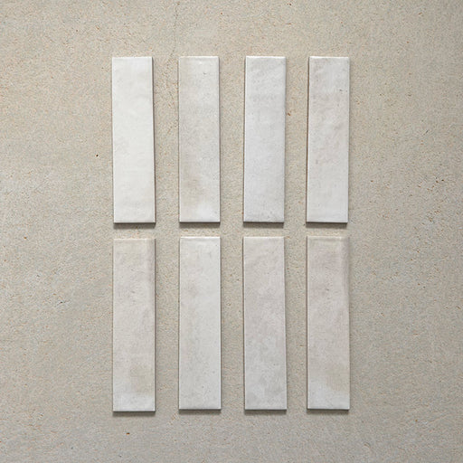 Izmir Brick Blanco Gloss Wall Tiles 6x25cm — a refined selection of glossy white brick tiles with delicate tonal variation. Their handcrafted appearance and soft, luminous finish make them ideal for brightening kitchens, bathrooms, and feature walls with timeless elegance.