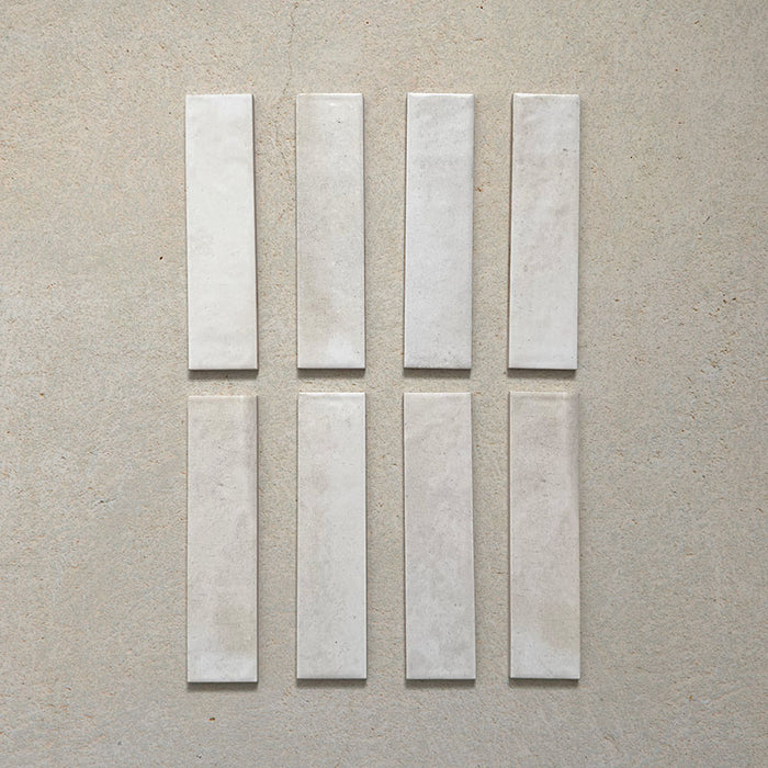 Izmir Brick Blanco Gloss Wall Tiles 6x25cm — a refined selection of glossy white brick tiles with delicate tonal variation. Their handcrafted appearance and soft, luminous finish make them ideal for brightening kitchens, bathrooms, and feature walls with timeless elegance.
