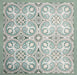 Group of Europa Toulouse 20x20cm Victorian Moroccan style tiles arranged together to display the repeating ornamental pattern in green, grey and cream tones, shown against a textured green background in a styled product layout.