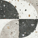 Tulsa Decor Terrazzo 66 × 66cm porcelain wall and floor tile, featuring a terrazzo base with multicoloured aggregate chips combined with bold geometric quarter-circle patterning in contrasting light and dark tones, creating a striking, contemporary statement design.