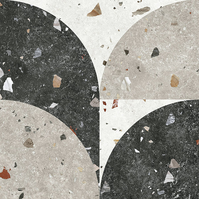 Tulsa Decor Terrazzo 66 × 66cm porcelain wall and floor tile, featuring a terrazzo base with multicoloured aggregate chips combined with bold geometric quarter-circle patterning in contrasting light and dark tones, creating a striking, contemporary statement design.