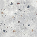 Flat lay of Tulsa Silver Terrazzo 66 × 66cm porcelain wall and floor tile, featuring a soft grey base with scattered multicoloured aggregate chips in varied sizes, creating a balanced, contemporary terrazzo effect with subtle movement and texture.