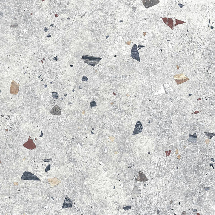 Flat lay of Tulsa Silver Terrazzo 66 × 66cm porcelain wall and floor tile, featuring a soft grey base with scattered multicoloured aggregate chips in varied sizes, creating a balanced, contemporary terrazzo effect with subtle movement and texture.