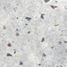 Flat lay of Tulsa Silver Terrazzo 66 × 66cm porcelain wall and floor tile, featuring a soft grey base with scattered multicoloured aggregate chips in varied sizes, creating a balanced, contemporary terrazzo effect with subtle movement and texture.