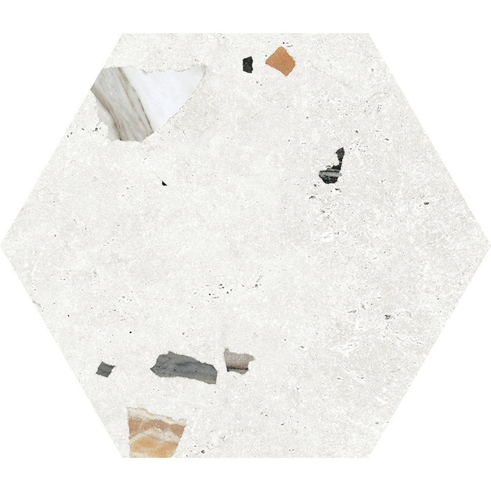 Flat lay of Tulsa White Terrazzo Hexagon 25 × 22cm porcelain wall and floor tile, featuring a crisp white base with scattered multicoloured aggregate chips in varied sizes, creating a clean, contemporary terrazzo effect with subtle texture and movement.