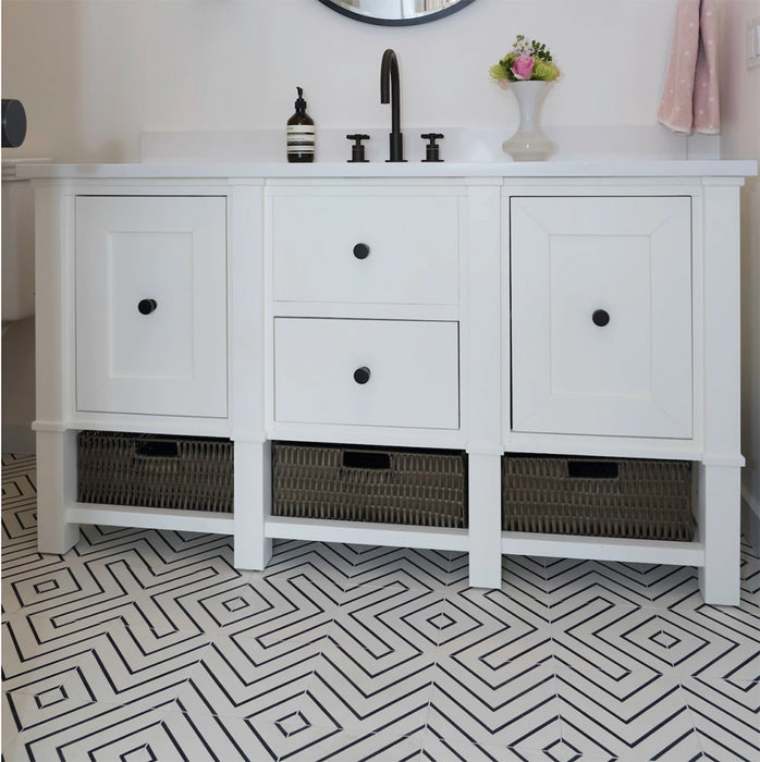 Alhambra Zig Zag Blanco 20x20cm Moroccan tiles used as flooring beneath a white vanity unit with black handles, showcasing the striking black and white chevron pattern that adds a modern geometric touch to the bathroom.