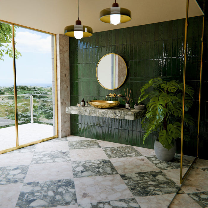 Luxury bathroom featuring Venetian Emerald Matt 60cm x 60cm terrazzo effect porcelain floor tiles in a chequerboard layout, paired with glossy green wall tiles, brass accents and a marble vanity for a contemporary spa-inspired space.