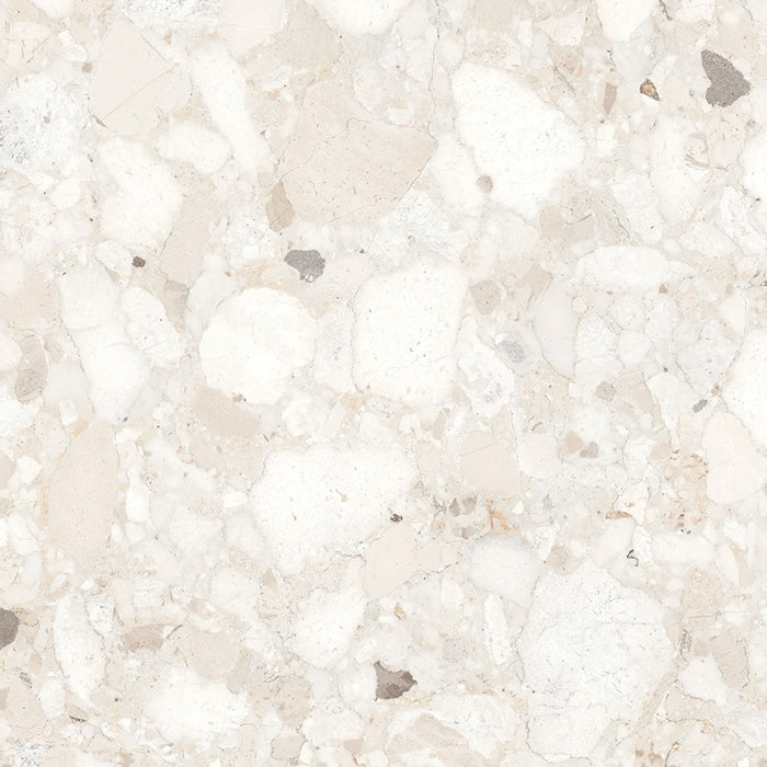 Close-up of Venetian Ivory 60cm x 60cm terrazzo effect polished porcelain tile, featuring soft ivory, cream and beige tones with natural stone-inspired aggregates for elegant contemporary wall and floor designs.