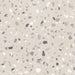 Close-up of Veneto Medium Sand concrete effect porcelain tile featuring a warm sand-coloured background with medium terrazzo stone chips in soft grey, beige and white tones, creating a contemporary surface for walls and floors.