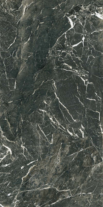 Close-up of Grand Verde Alpi Polished Marble effect 60 × 120cm porcelain tile, featuring deep green tones with bold white veining and a high-gloss finish that enhances depth, contrast, and natural movement.