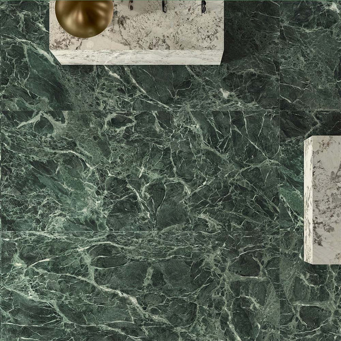Bathroom interior featuring Grand Verde Apia Polished Green Marble effect 60 × 60cm porcelain wall and floor tiles, styled with a floating vanity, brass basin, and rich green tones with intricate natural veining.