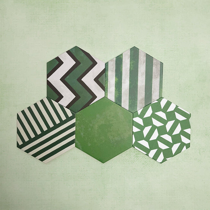 Fihrdos Verde Hexagon Patchwork Moroccan-style 18.7x21.6cm patterned porcelain tiles arranged in a grouped layout, showcasing a mix of green-toned geometric and floral-inspired designs.