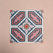 Four Europa Vienna 20x20cm Victorian Moroccan style tiles arranged together to showcase the repeating geometric pattern in blue, pink and coral tones, displayed against a soft pink background.
