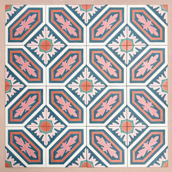 Group of Europa Vienna 20x20cm Victorian Moroccan style tiles arranged together to showcase the repeating geometric pattern in blue, pink and coral tones, displayed against a soft pink background.