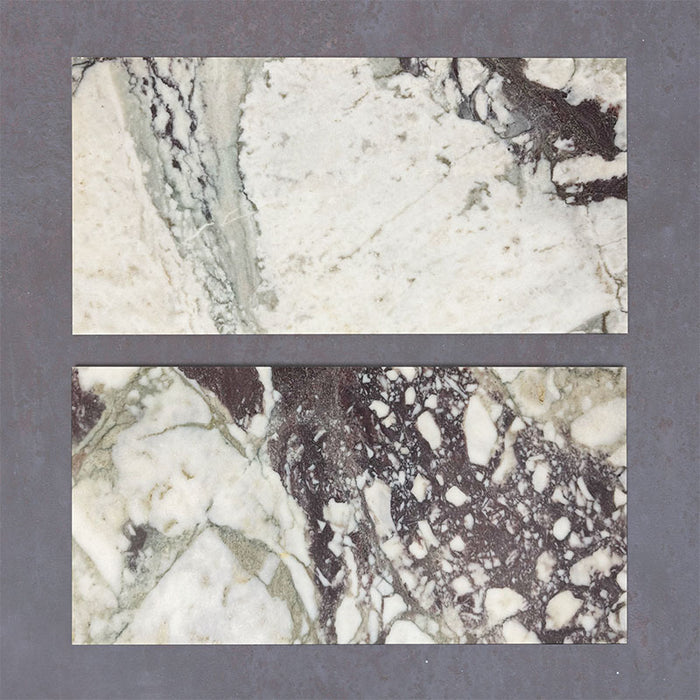 Close-up of Fitzrovia Viola natural marble tiles in a honed finish, 30.5x61cm format, showcasing a soft white base with striking violet and deep grey veining, creating a bold yet refined look for wall and floor applications.