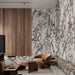 Living area featuring Grand Violetta Matt Honed Marble effect 60 × 60cm porcelain wall and floor tiles, styled with warm wood panelling, leather seating, and bold veining creating a rich, design-led space.