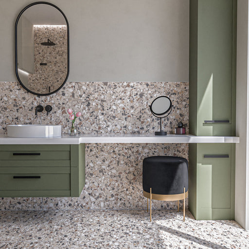 Bathroom featuring Vito Dolomite 60cm x 120cm terrazzo style tiles with a 4D brushed finish, showcasing a mix of warm neutral and grey stone-style fragments, paired with sage green cabinetry and black details.