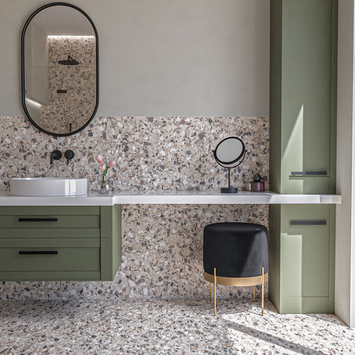 Bathroom featuring Vito Dolomite 60cm x 120cm terrazzo style tiles with a 4D brushed finish, showcasing a mix of warm neutral and grey stone-style fragments, paired with sage green cabinetry and black details.