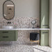 Bathroom featuring Vito Dolomite 60cm x 120cm terrazzo style tiles with a 4D brushed finish, showcasing a mix of warm neutral and grey stone-style fragments, paired with sage green cabinetry and black details.